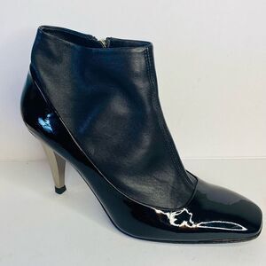 🛍️ Giuseppe Zanotti Black Leather Ankle Booties with Sculpted Heel